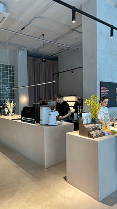 people are standing at the counter in an office