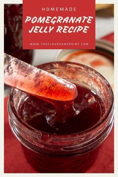 homemade pomegranate jelly recipe in a glass jar with a spoon on top