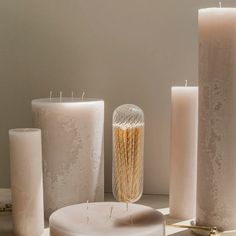 some candles are sitting next to each other