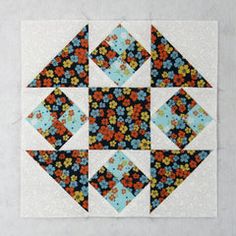 the block is made up of different colored flowers