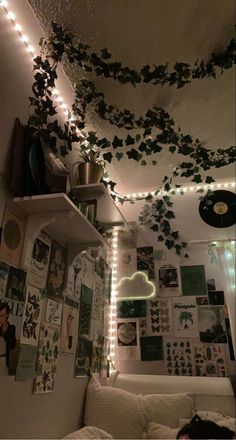 a living room filled with lots of pictures and lights