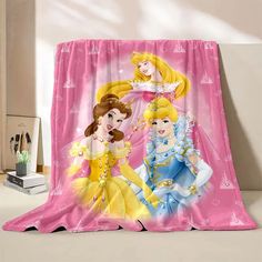 two princesses are standing in front of a pink curtain with the same image on it