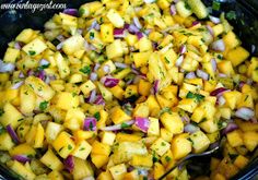 a bowl filled with chopped pineapple and onions