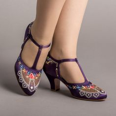 As hemlines rose in the 1920s, flashy footwear was all the rage, and the Daisy Embroidered T-Strap heels are just the ticket. Made in luminous satin heavily embroidered in a gorgeous botanical design, the Daisy T-Strap Shoes are closely based on an original pair in Bata Shoe Museum. These gorgeous shoes are accurate for the 1920s, 1930s, and 1940s, and offer our refined and stable 2.5 in / 6.3 cm Spanish heel paired with open sides and an almond toe. Wear Daisy embroidered 1920s shoes with any g Motorcycle Festival, Witch Purple, Bata Shoes, 1920s Shoes, American Duchess, Sensible Shoes, Boutique Closet, Romantic Fashion, T Strap Shoes