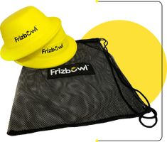 a frisbee sitting on top of a mesh bag next to a yellow frisbee