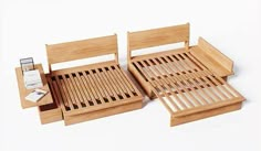 two wooden trays sitting on top of each other