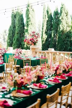 an image of a table set up with flowers and greenery on the tables for a wedding