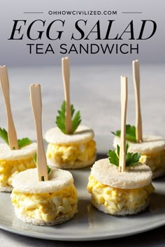 egg salad tea sandwiches on a plate with toothpicks