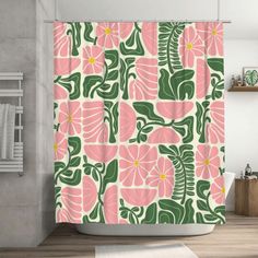 a shower curtain with pink and green flowers on it