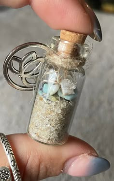 "Need a little piece of the beach with you? I've conjured up this small spell jars full of some jersey shore sand, aquamarine or larimar chips, shell pieces or slivers, pieces of bay leaf or sage or lavender & a little sparkly geode piece or clear Quartz - then cork it up, adorn it with a charm & then you have your own personalized little \"piece of the sea\" jars! *empty small & XL spell jars available for your own restock available in our shop too! *pictures in photos are all different already Sand Jars, Small Jars Ideas, Small Glass Jar Crafts, Beach In A Jar, Beach In A Bottle, Tiny Spell Jars, Sea Witch Alter, Jar Of Shells, Sea Witch Spell Jar