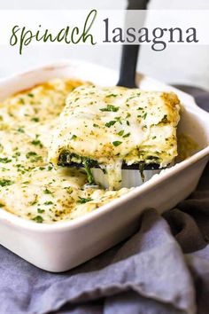 a casserole dish with broccoli and cheese in it on a blue towel