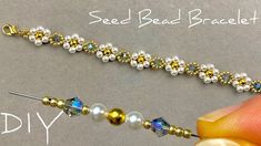 the bead bracelet is being made with beads and swarongs on it