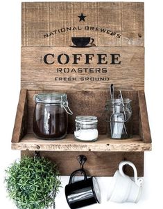 an old wooden box with coffee containers on it