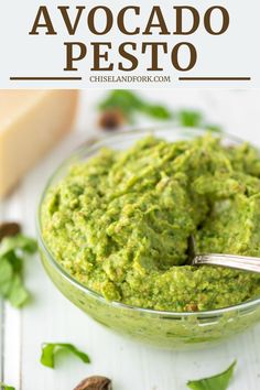 avocado pesto in a glass bowl with a spoon