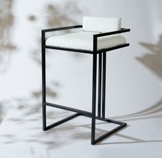 a black and white chair with a towel on it