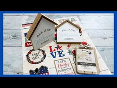 various items are displayed on top of a wooden table with the words all are welcome here