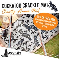 an advertisement for cockatoo crackle mat, featuring birds and flowers on the ground