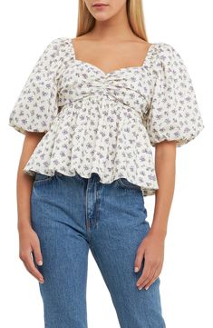 This flowery puff-sleeve blouse designed with a smocked back and a flouncy finish. Sweetheart neck Elbow-length sleeves Lined 100% cotton Dry clean Imported Boho Feminine Style, Floral Puff Sleeve Top, Blouse Designed, Cute Modest Outfits, Dressy Shirts, English Factory, Woman Looking, Puff Sleeve Blouse, Sweet Heart