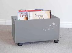 a grey toy box with books in it