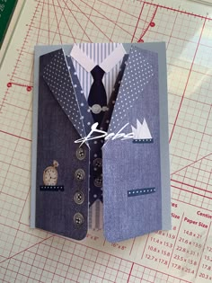 a folded up card with a suit and tie on it