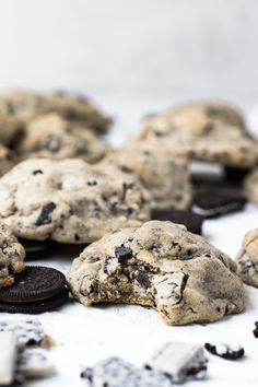 chocolate chip cookies and oreo cookies on a white surface