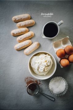 doughnuts, cream and other ingredients on a gray surface with the words how to make homemade donuts