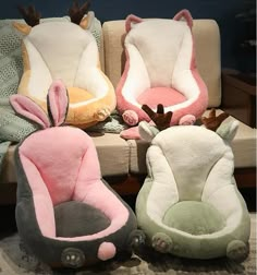 four stuffed animals are sitting in different colors and sizes on a couch with the caption bag house & bed