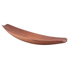 a wooden boat shaped object on a white background