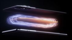 the back side of an apple laptop with light streaks coming out of it's screen