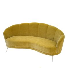 a yellow curved couch sitting on top of a white floor