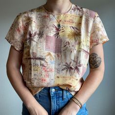 "Vintage 80s Christie and Jill 100% Silk Feminine Short Sleeve Blouse Sz L Size large 100% silk Button back Color: pink + peach Lightweight Modeled on a medium/ size 6/ 5 foot 7/ 140lbs/ 34 C Collar to hem: 23\" Pit to pit: 20\"" Vintage Silk Top With Floral Print, Vintage Crew Neck Blouse For Summer, Vintage Peach Tops For Spring, Peach Vintage Spring Tops, Vintage Silk Tops For Spring, Vintage Silk Summer Blouse, Vintage Silk Blouse For Summer, Vintage Silk Tops For Summer, Vintage Silk Summer Tops