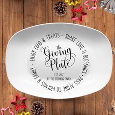 personalized serving platter with pine cones and star shaped cookie cutters around it