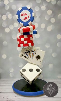 a stack of cards and dice on top of each other with the words all in