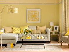 a living room filled with furniture and yellow accents