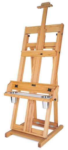 an artist's easel with two buckets on the bottom and one standing upright