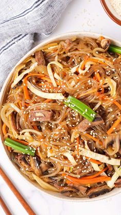 Bowl of japchae noodles. Japchae Noodles, Korean Noodle Dishes, Korean Glass Noodles, Noodle Stir Fry, Plaid Apron, Sweet Potato Noodles, Bulgogi Beef, Korean Beef