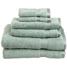 six towels stacked on top of each other in light green color, with one folded and the