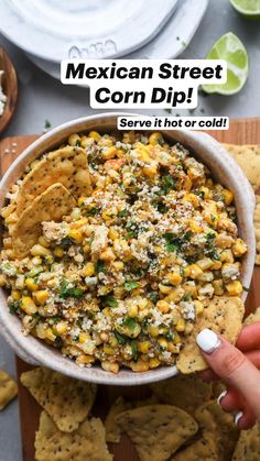 a bowl filled with corn salsa and tortilla chips