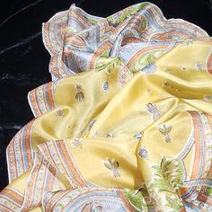 Spectacular Vintage Collectable Lembeck Silk Scarf. Paisley On Yellow Background. The Colors Are Yellow, Blue, Orange, Green,White And A Dash Of Brown. The Hand Rolled Edge Is Exquisite, Following The Pattern Of The Fabric As It Cascades Along The Edge. Very Difficult To Achieve This Edge With Hand Rolling. The Silk Has A Lovely Sheen. This Brand Is Very Difficult To Come By. Excellent Vintage Condition. There Is A Shadow Where Something May Have Gotten On It At Some Point In The Last Picture. L Elegant Yellow Silk Scarf For Spring, Elegant Yellow Silk Scarf, Vintage Yellow Silk Scarf, Yellow Silk Scarf For Summer, Yellow Scarf, Vintage Silk Scarf, Hand Roll, Yellow Background, Vintage Silk