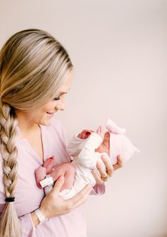 a woman holding a baby in her arms