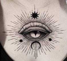 a woman's chest with an all seeing eye tattoo on it