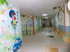 the hallway is decorated with colorful wallpapers and cartoon characters on it's walls