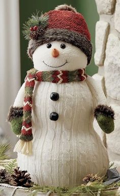 a snowman is wearing a hat and scarf