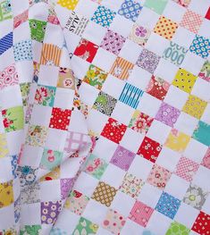 the colorful quilt has many different designs on it