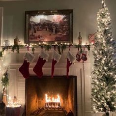 a fireplace with stockings hanging from the mantle