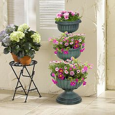 three flower pots are stacked on top of each other