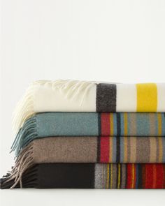 three blankets stacked on top of each other