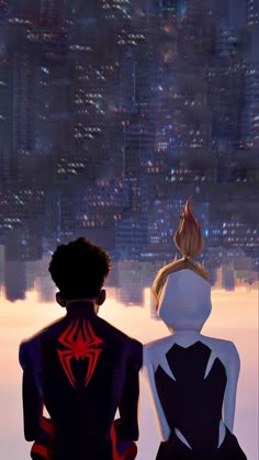 two people sitting in front of a cityscape