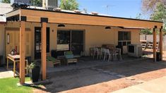 a patio covered in furniture next to a building