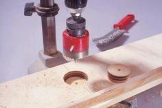 a drill and some tools on a workbench